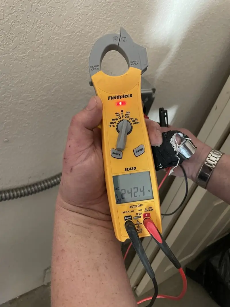 Voltage testing with clamp meter during Outlet Installation in Kimberly